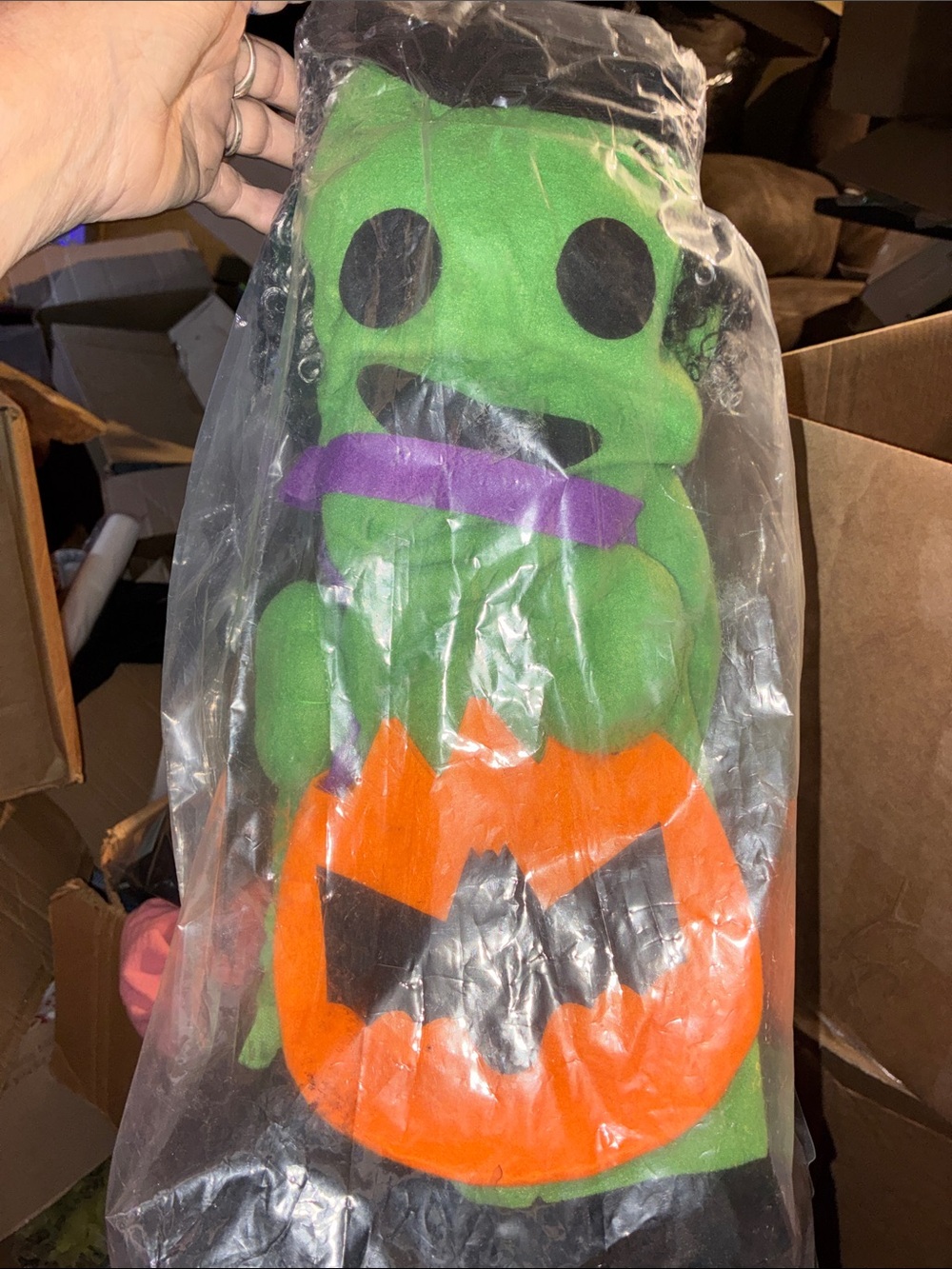 Frankenstein figure with Orange Jack-O'-Lantern
